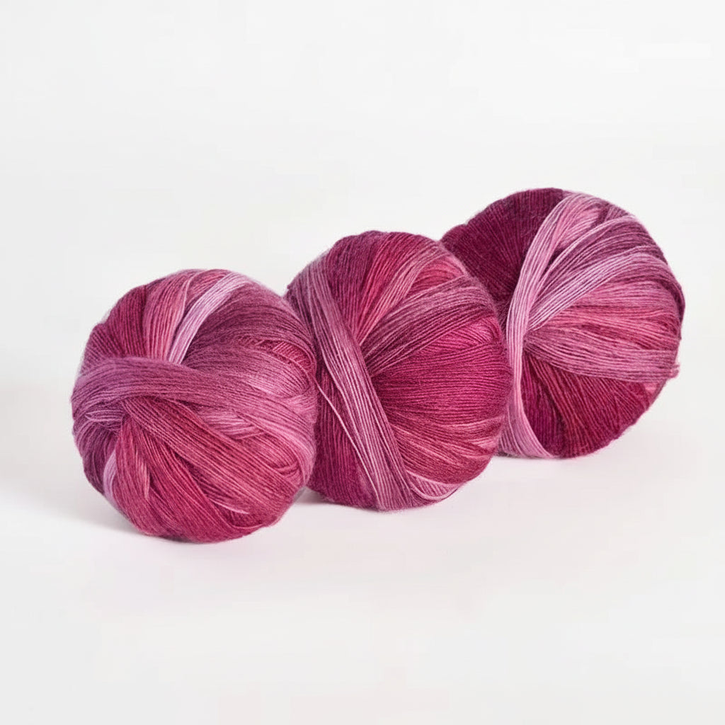 Three skeins of pink yarn with color code 615 on a white background
